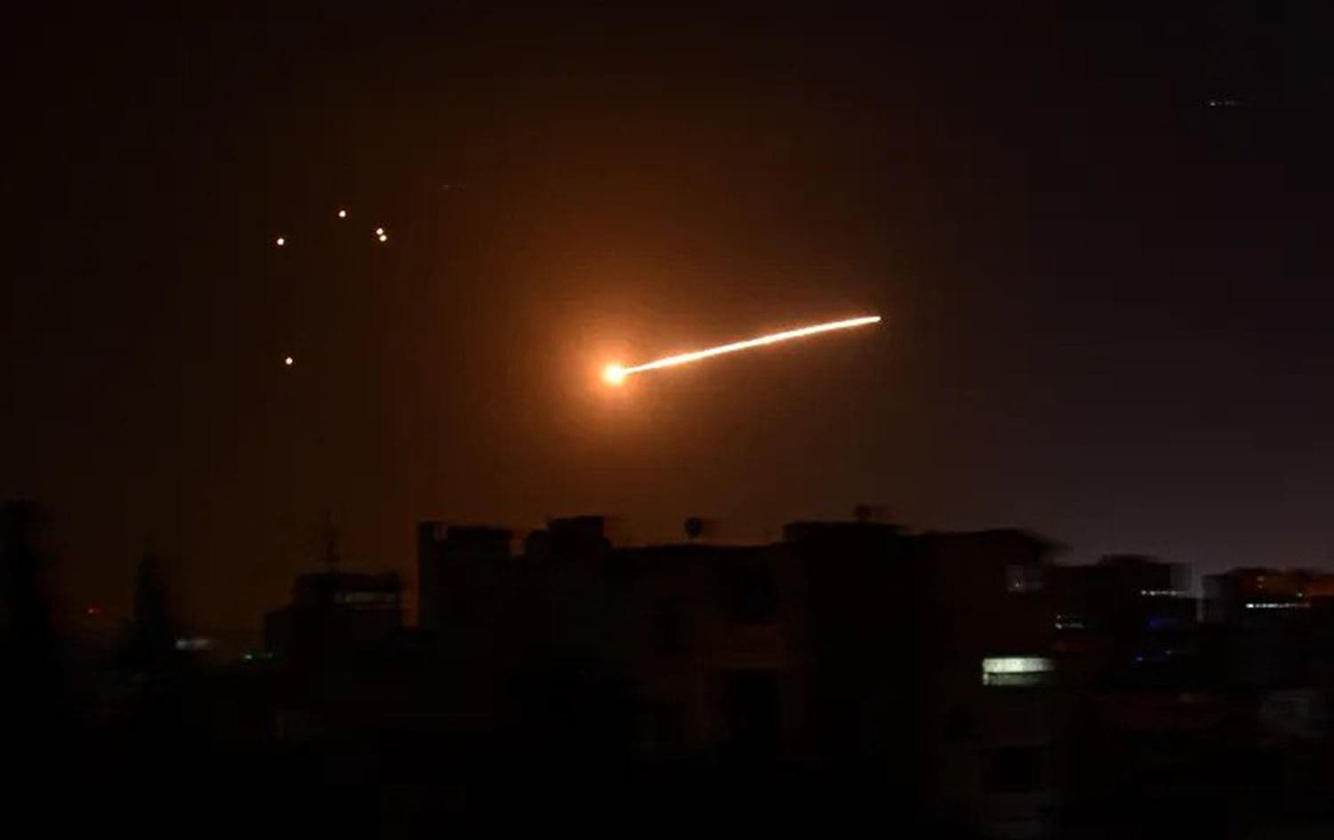 A handout picture released by SANA on February 24, 2020 reportedly shows Syrian air defense intercepting an Israeli missile in the sky over the Syrian capital Damascus. Photo: AFP