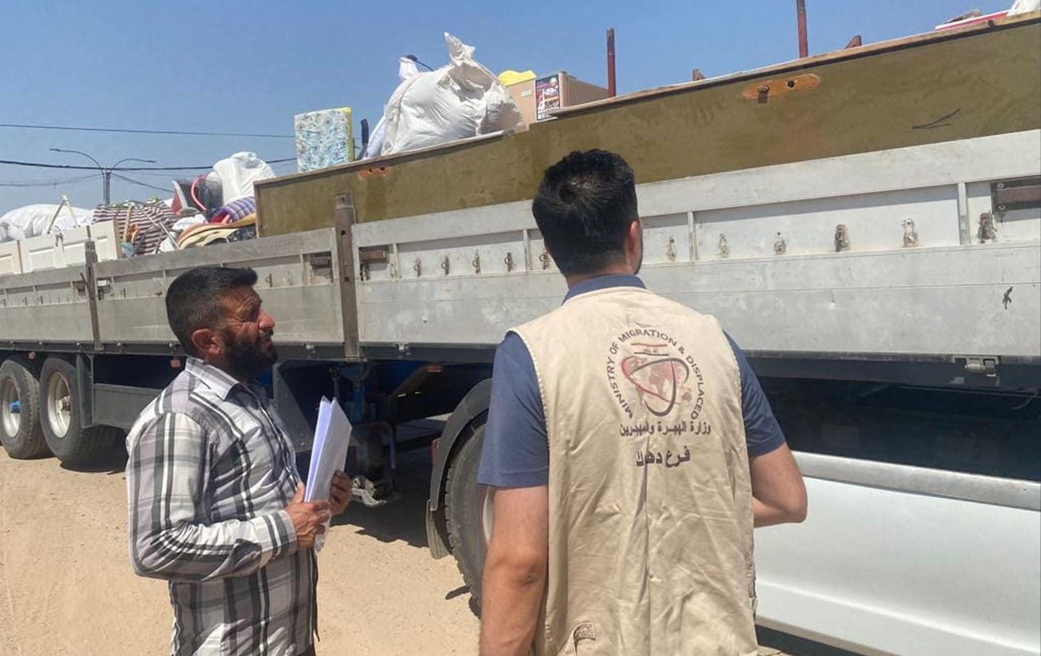 Yazidis pack their belongings into trucks as they return to Shingal. Photo: handout/Iraq migration ministry