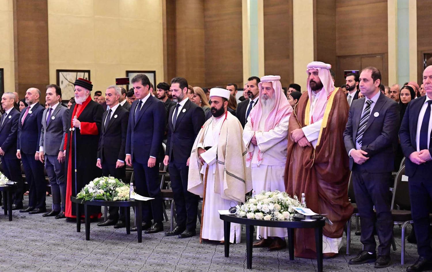 Attendees observe a minute of silence at a conference titled "Towards a sustainable future for Yazidis in Iraq & KRI" on the ninth anniversary of the Yazidi genocide on August 3, 2023 in Erbil. Photo: Kurdistan Region Presidency