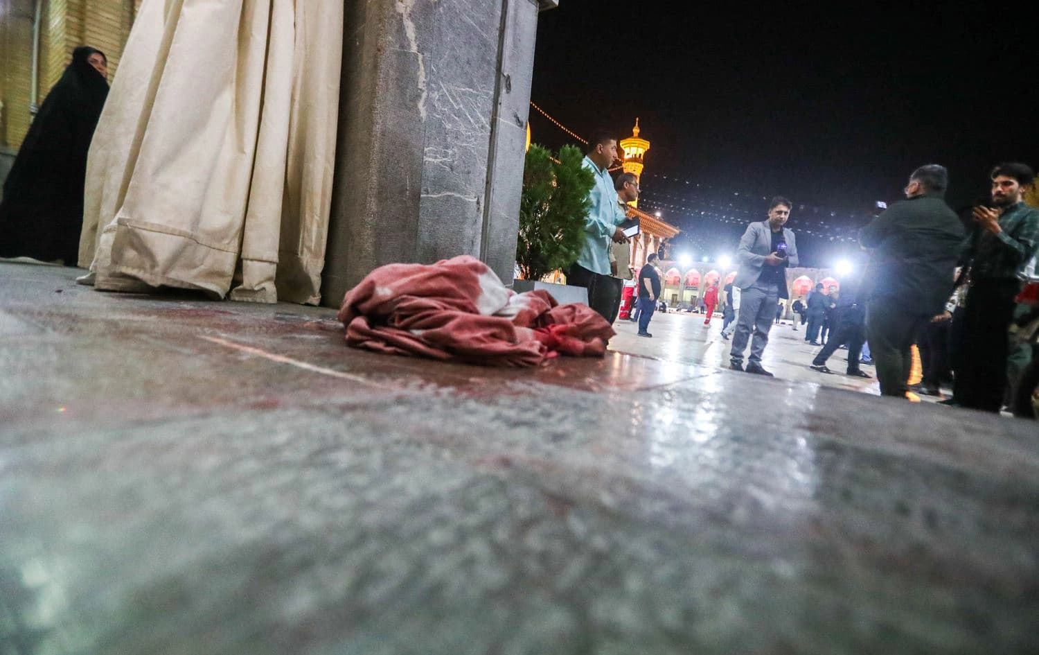 A blood-stained cloth lies on the ground at the site of a shooting attack at Iran's Shah Cheragh mausoleum in the Fars province capital Shiraz, on August 13, 2023. Photo: Mohammadreza Dehdari/ISNA/AFP