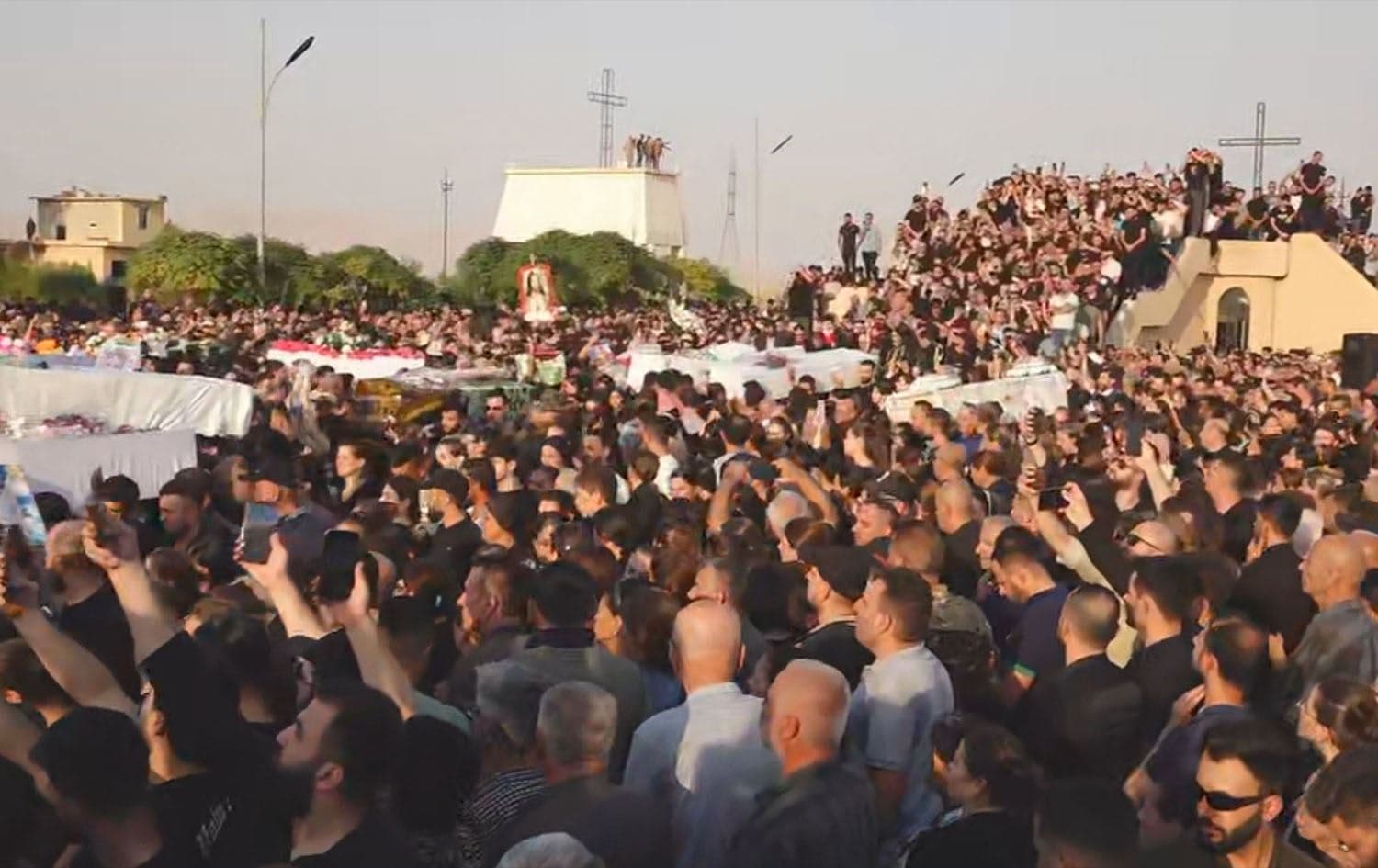 Mourners attend the funeral of victims who were killed when a fire ripped through a crowded wedding hall in the Assyrian Christian northern district of Hamdaniya on September 27, 2023. Photo: Rudaw