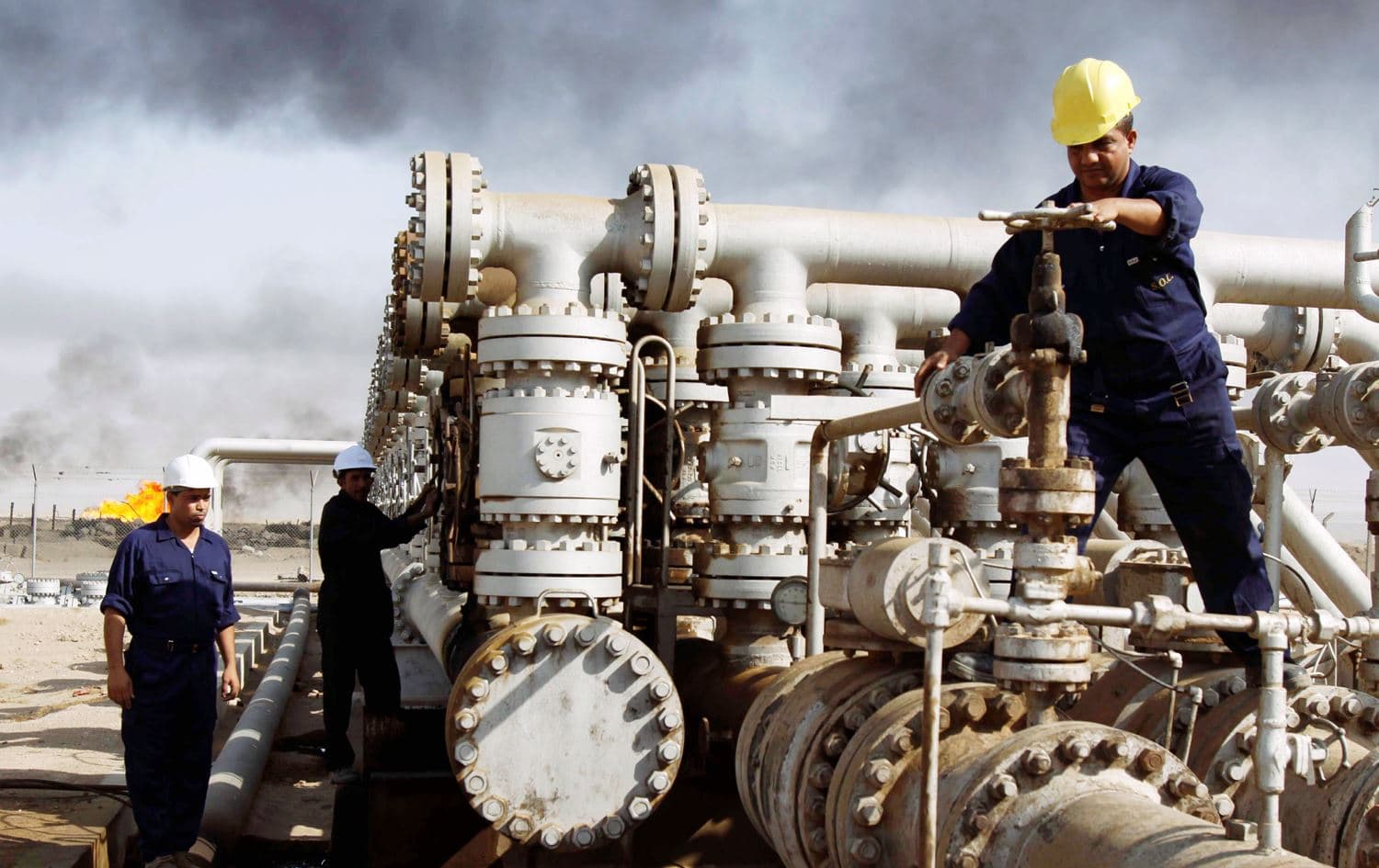 Workers at the Rumaila oil refinery in Zubair, Iraq on December 13, 2009. Photo: AP