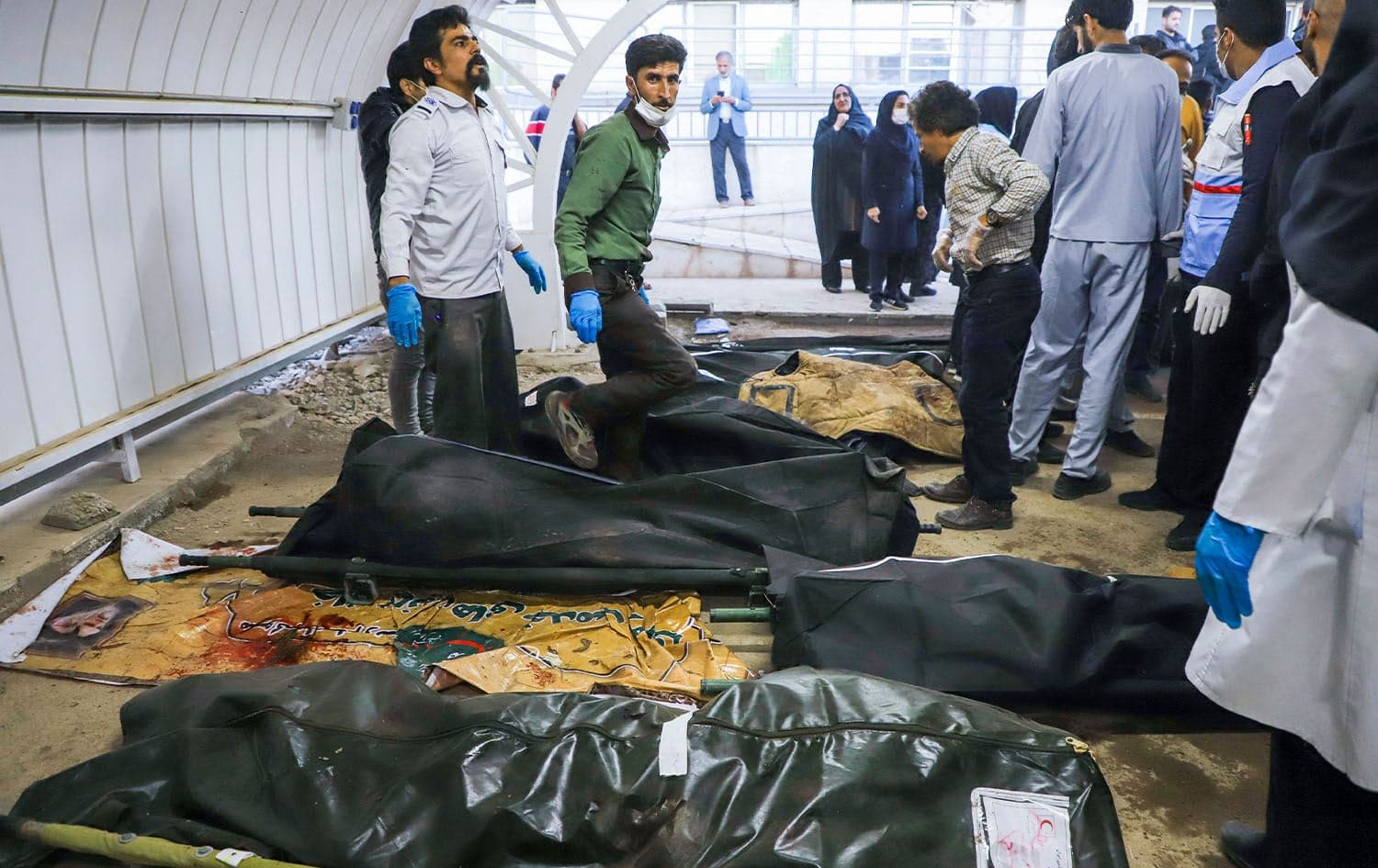 The bodies of victims killed in two explosions in quick succession that struck a crowd marking the anniversary of the 2020 killing of Guards general Qasem Soleimani, lie at a hospital in the southern Iranian city of Kerman on January 3, 2024. Photo: Sare Tajalli/ISNA/AFP