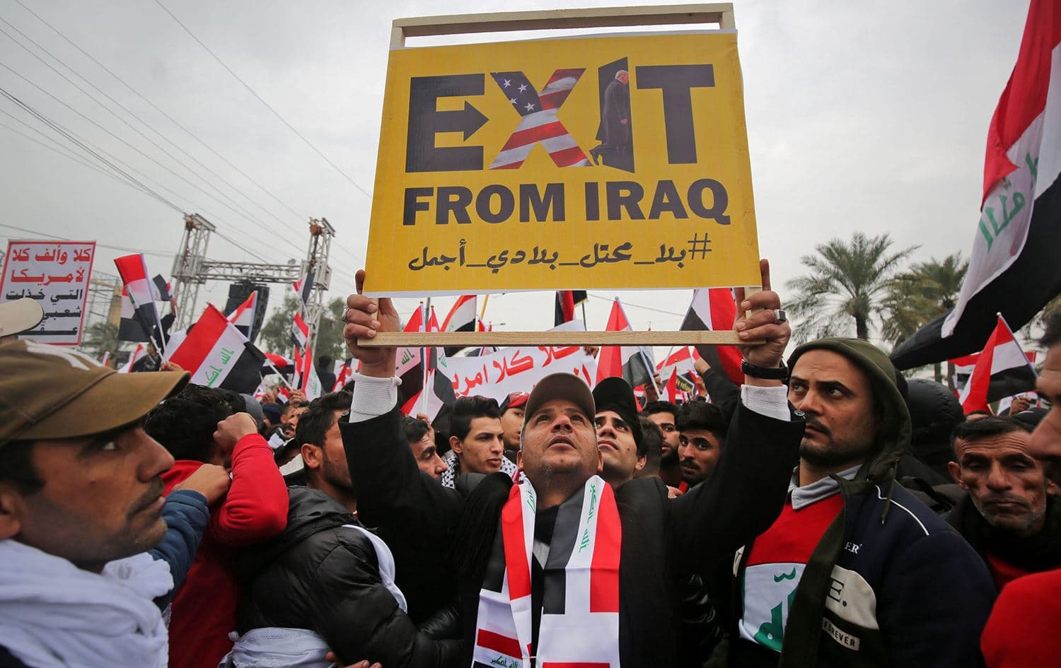 A protester in Baghdad holds a placard calling for the expulsion of US forces from Iraq on January 24, 2020. Photo: Ahmad al-Rubaye/AFP