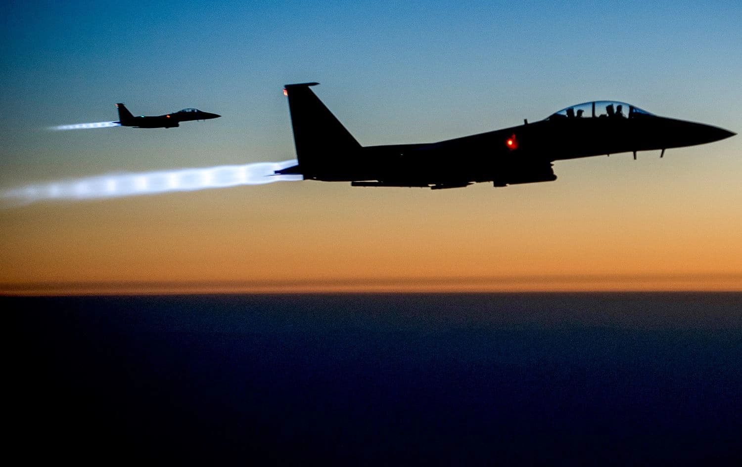 Handout photo showing a US Air Force F-15E Strike Eagles flying over northern Iraq on September 23, 2014, after conducting airstrikes in Syria. Photo: Matthew Bruch/DVIDS/AFP