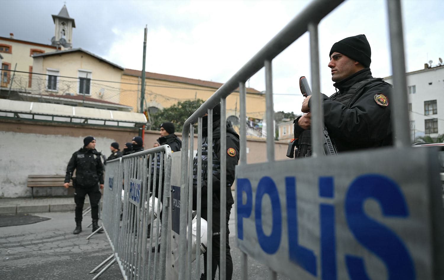 Turkish anti riot police officers block the street of Santa Maria church after an attack in Istanbul, on January 28, 2024. Photo: Ozan Kose/AFP