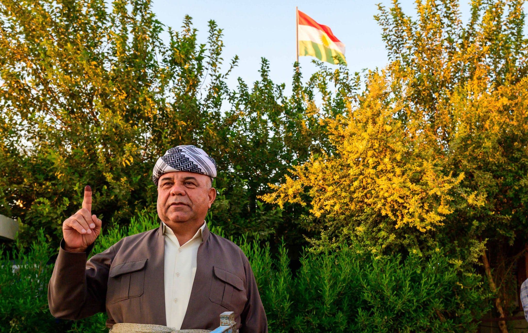 A Kurdish man poses with his inked index after casting in his vote. Photo: Rudaw/file