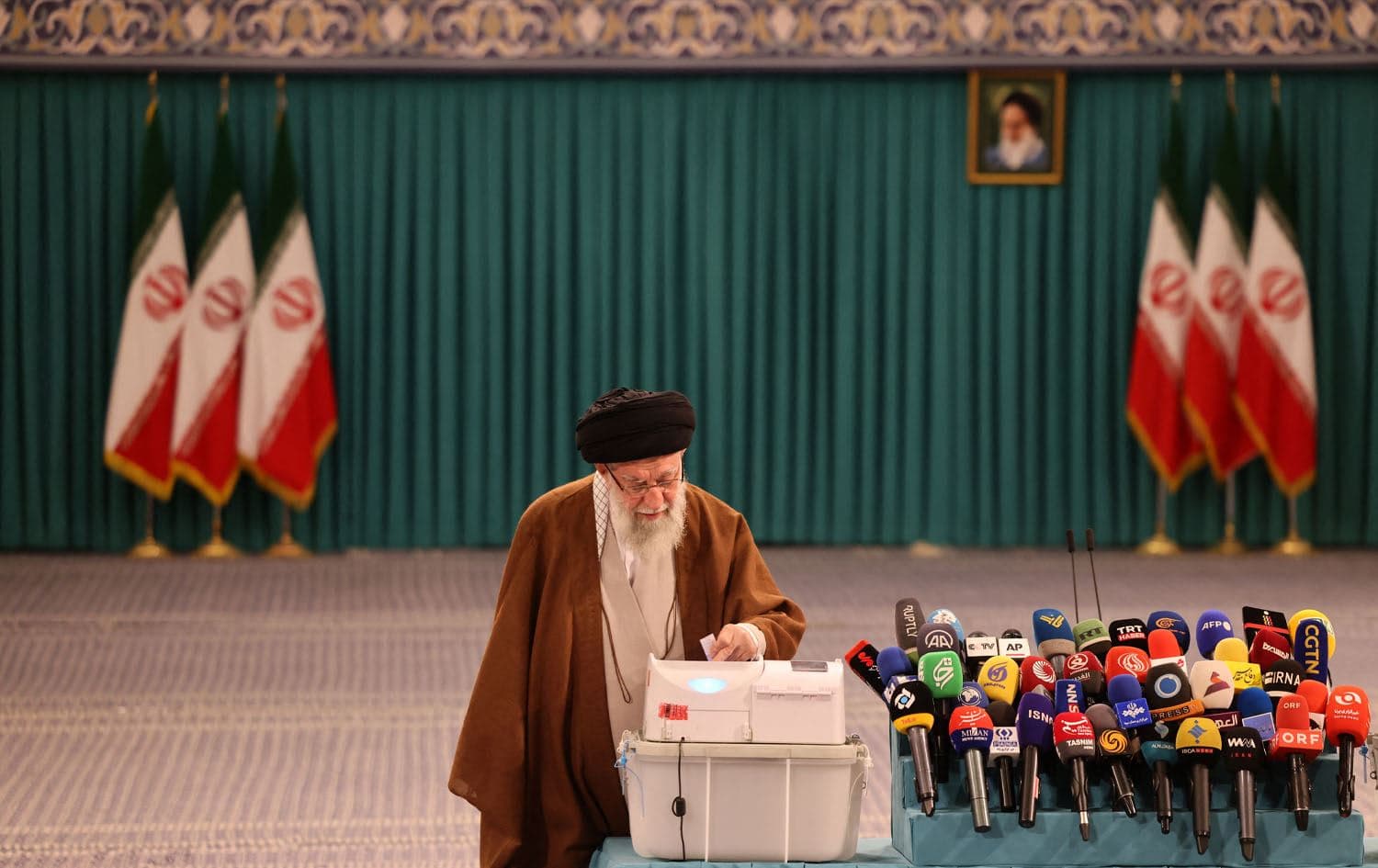 Iran's Supreme Leader Ayatollah Ali Khamenei casts his ballot during the parliamentary runoff elections in Tehran on May 10, 2024. Photo: ATTA KENARE / AFP