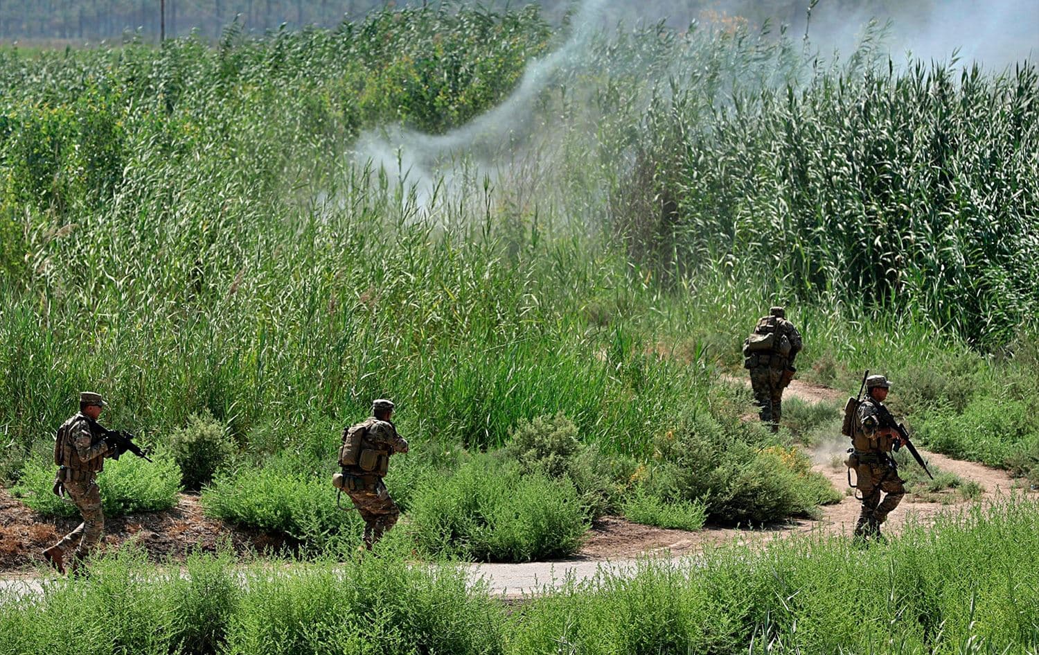 Iraqi security forces detonate an explosive device during a search operation in Tarmiyah, north of Baghdad, on July 23, 2019. Photo: Hadi Mizban/AP
