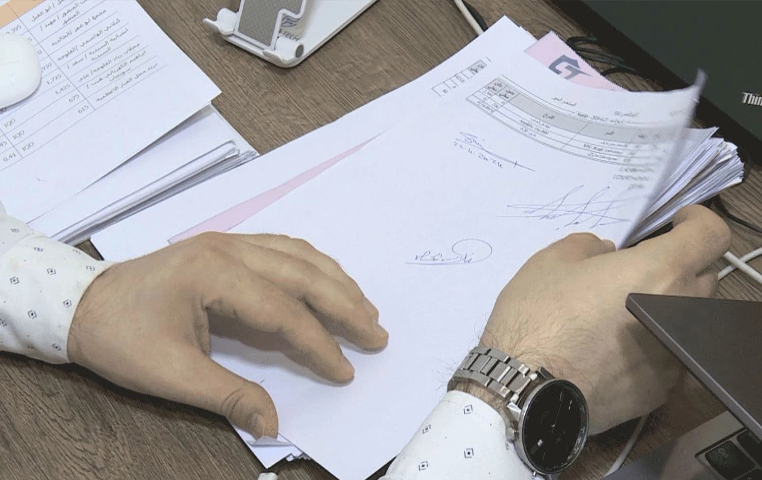 A Syrian businessman in Erbil showing legal paperwork on May 25, 2024. Photo: Rudaw