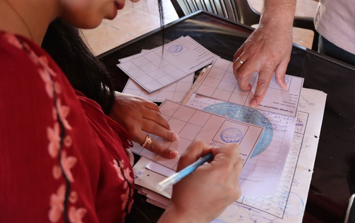 Rojava electoral authorities issue voting cards. Photo: ANHA/file