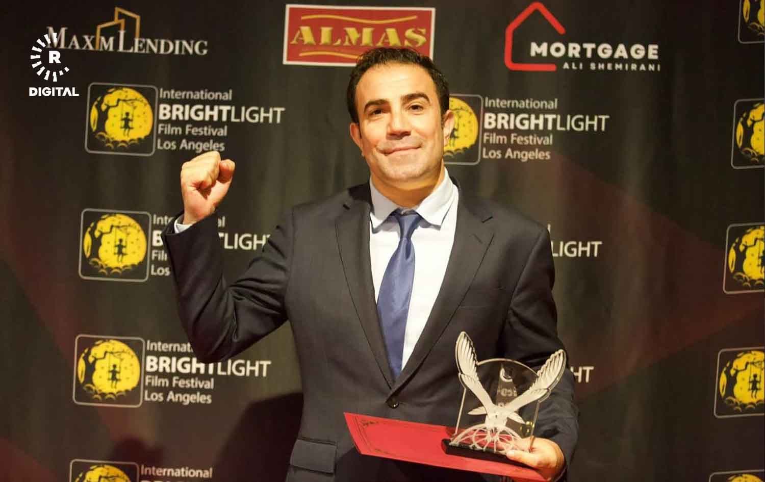 Rudaw's Sinan Tuncdemir with the International Brightlight Film Festival award for best documentary in Los Angeles, California on June 26, 2024. Photo: Rudaw