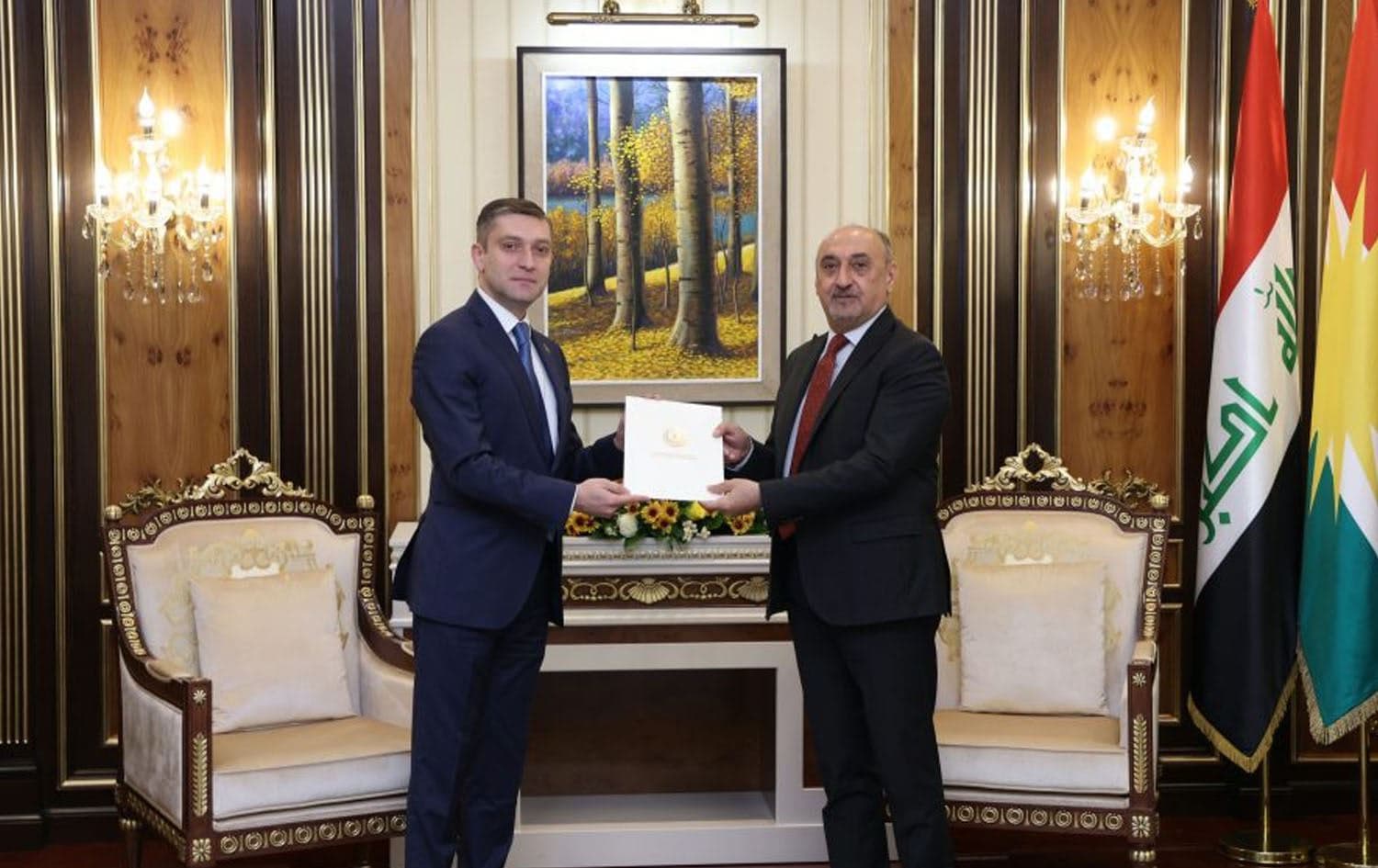 Fawzi Hariri (right), chief of staff to the Kurdistan Region Presidency, receives a formal invitation from Nasir Mammadov (left), Azerbaijani charge d'affaires to Iraq, inviting Kurdistan Region President Nechirvan Barzani to attend COP29, on July 22, 2024. Photo: Kurdistan Region Presidency