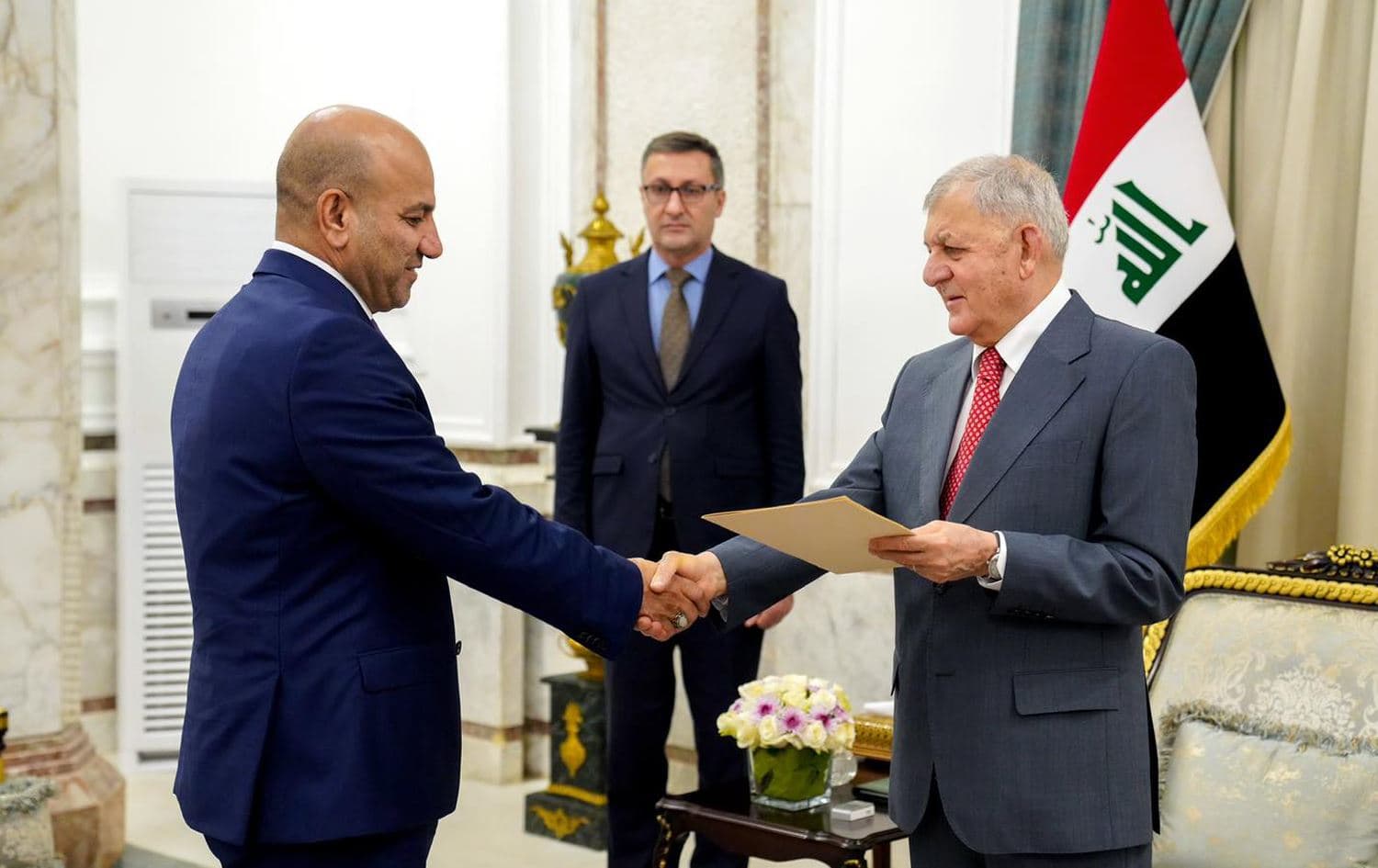 Iraqi President Abdul Latif Rashid hands Adnan al-Shammari the presidential decree designating him as Diyala governor on August 8, 2024. Photo: President Rashid's office