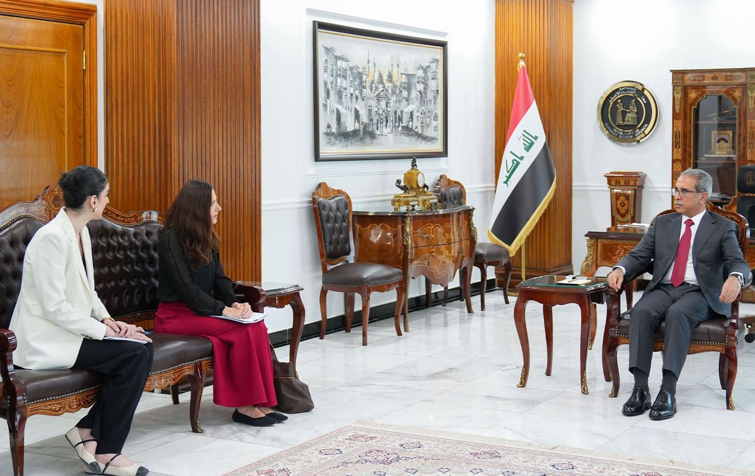 Judge Faiq Zidan (right) and UNITAD head Ana Peyro Llopis (center) in a meeting at the Supreme Judicial Council Media in Baghdad, Iraq, on August 11, 2024. Photo: Iraqi judicial council