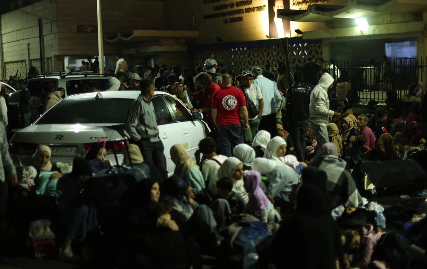 People and Syrian Red Crescent volunteers near the Lebanon-Syria border on September 25, 2024. Photo: Syrian Red Crescent