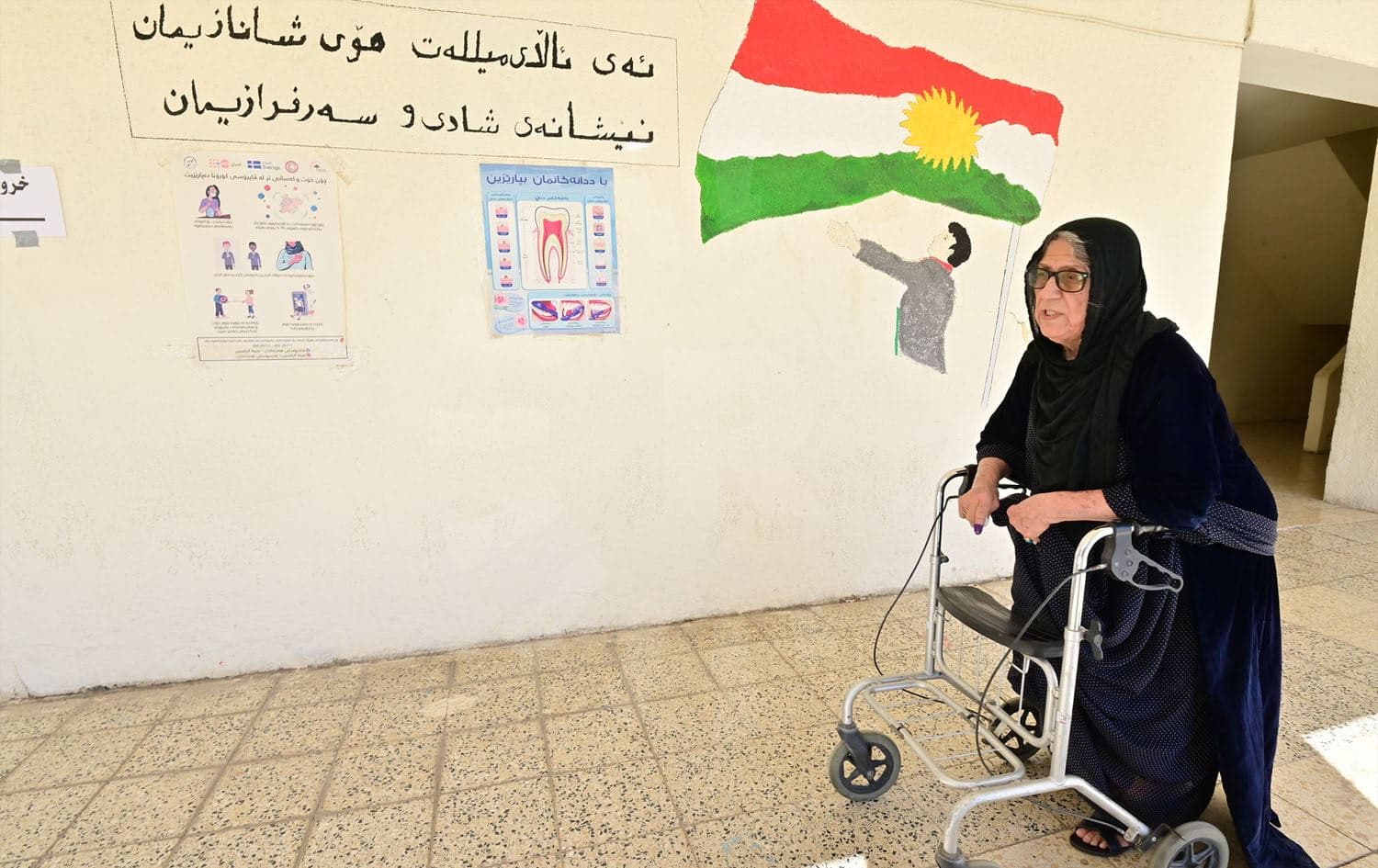An elderly Kurdish woman after casting her ballot in the October 2021 Iraqi parliamentary elections. Photo: Bilind T. Abdullah/Rudaw