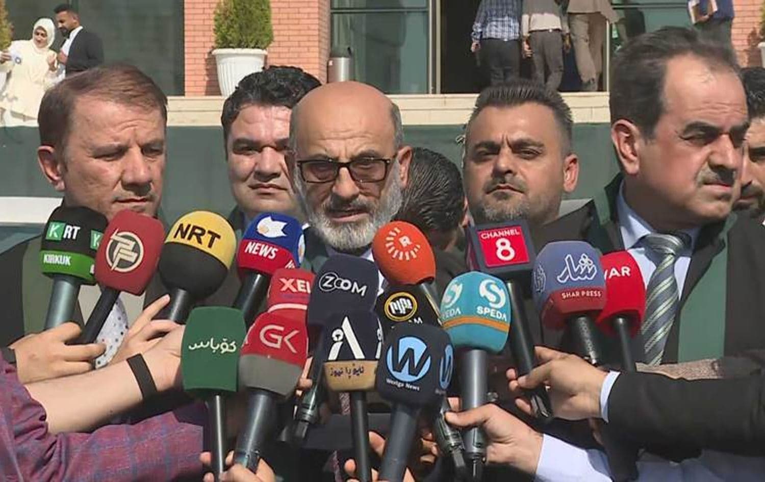 A group of lawyers speaking to reporters outside a courthouse in Erbil on October 10, 2024. Photo: Rudaw/screengrab
