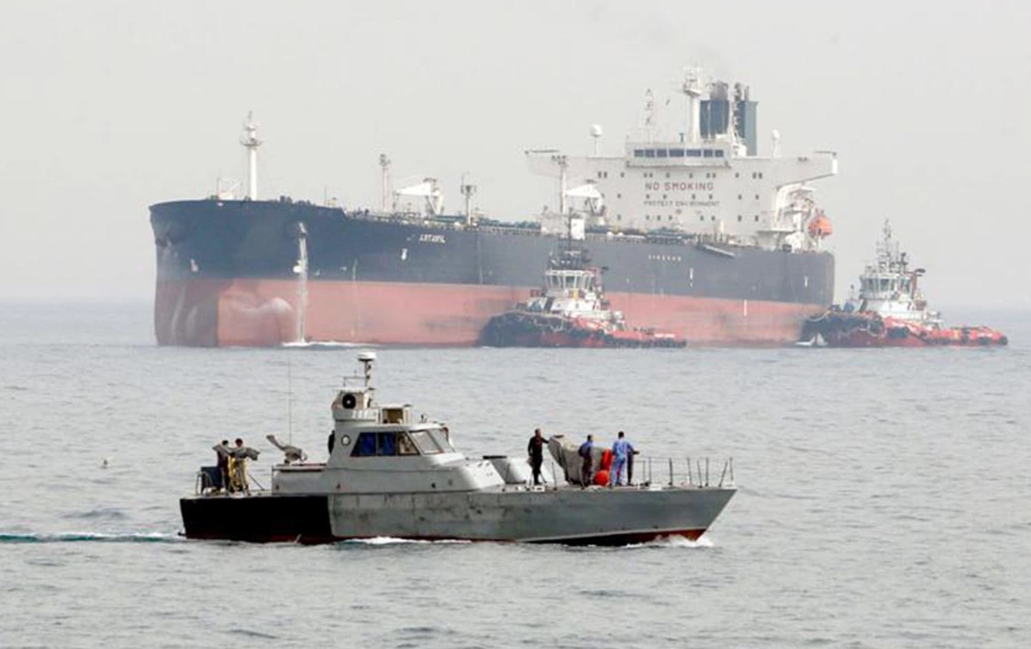 An Iranian military speedboat patrols the waters as a tanker prepares to dock at the oil facility on Khark Island, Iran, on March 12, 2017. Photo: AFP