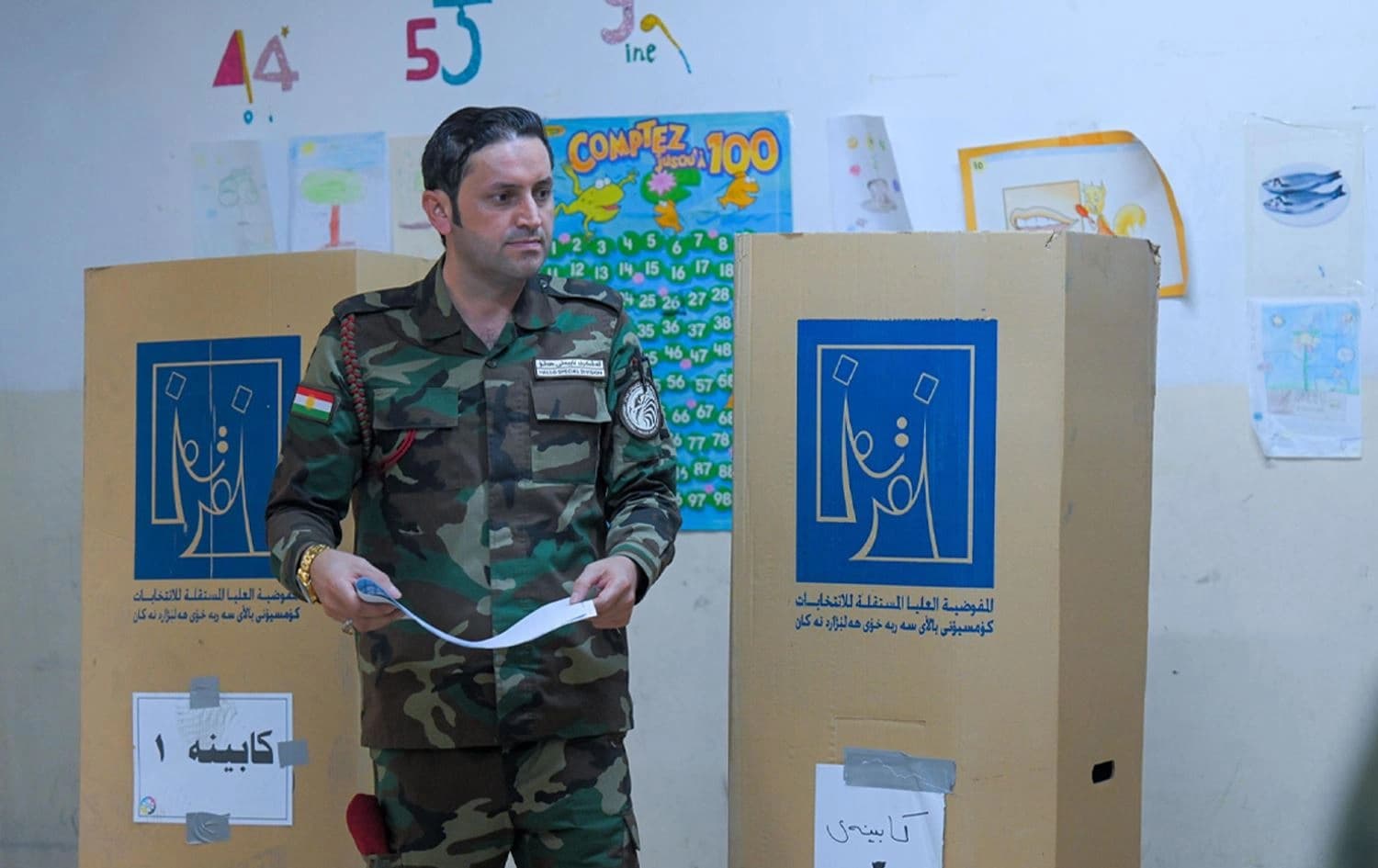A security force member casts a ballot for the Kurdistan Region’s early elections on October 18, 2024. Photo: Rudaw