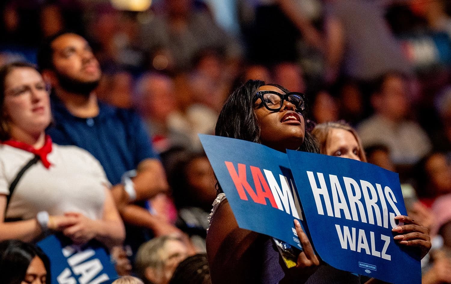 A woman holds posters during a campaign rally for Democratic presidential candidate Kamala Harris on August 6, 2024. Photo: AFP/Andrew Harnik