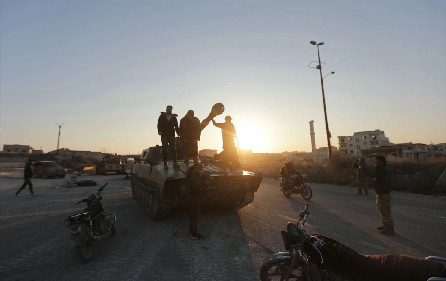 ژمارەیەک چەکداری دەستەی تەحریری شام لە باکووری رۆژئاوای ئیدلیب. وێنە: AFP