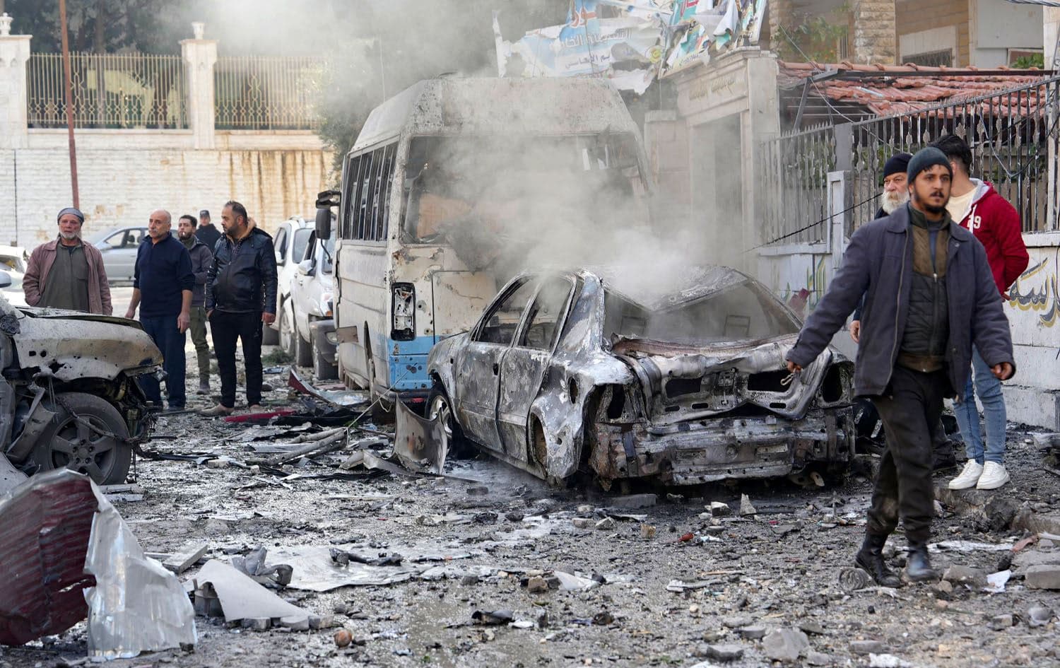 People check the damage at the scene of a pro-regime forces strike that targeted a neighbourhood in Syria's rebel-held northern city of Idlib on December 1, 2024. Photo: MUHAMMAD HAJ KADOUR / AFP