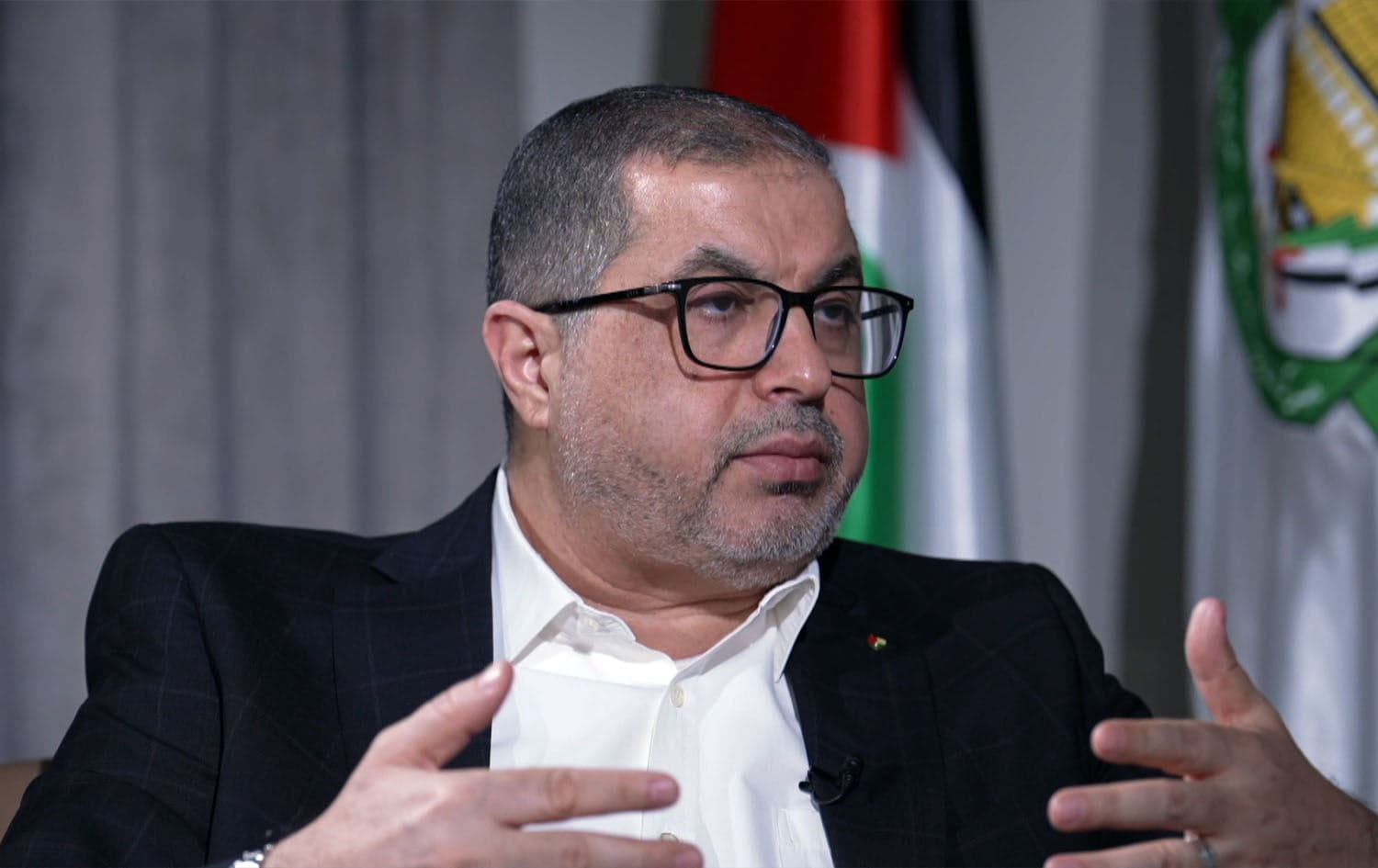 Basim Naim, former Palestinian health minister and a Hamas politburo member speaking to Rudaw in Doha on December 10, 2024. Photo: Rudaw