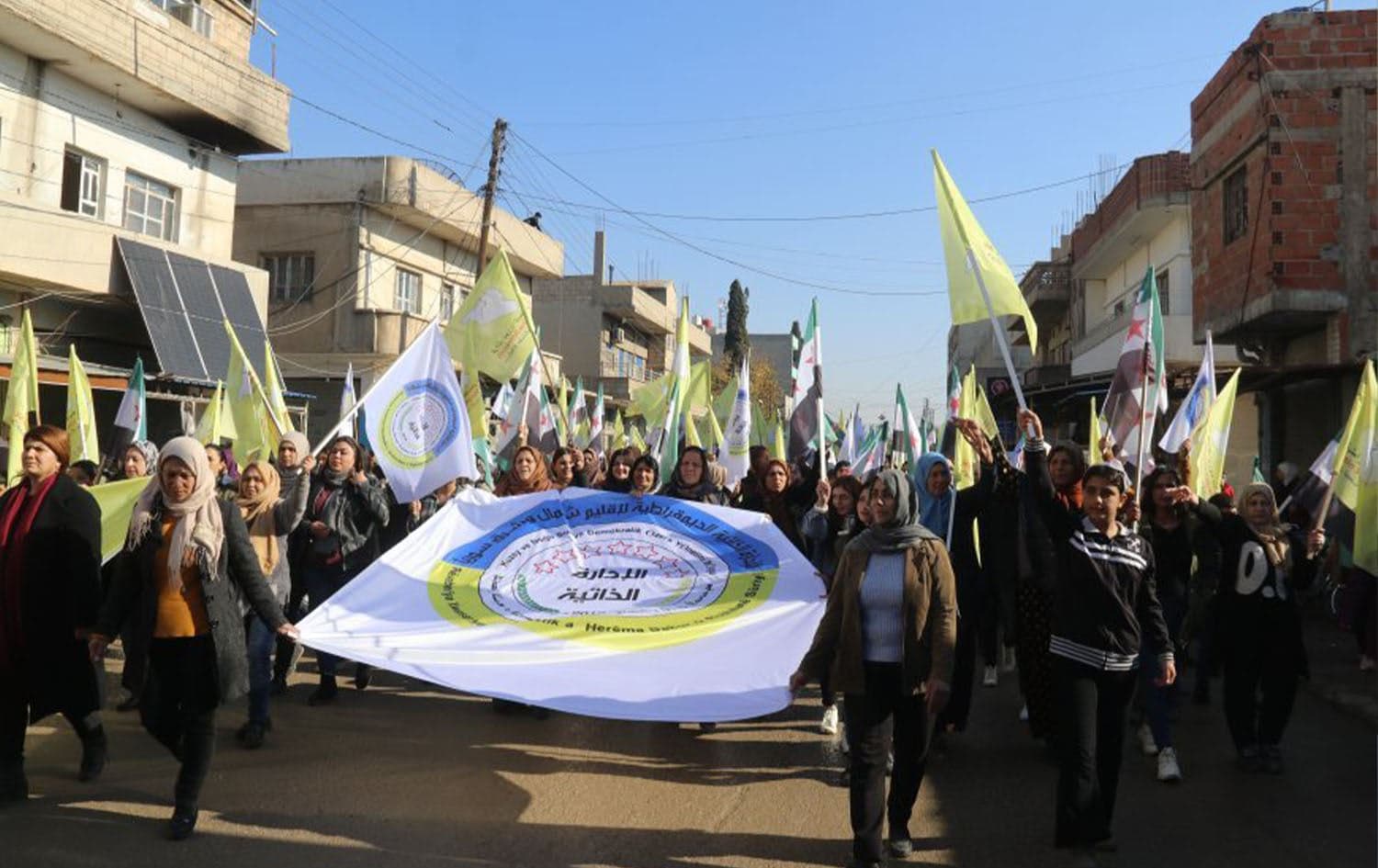 Residents of Tirbe Spiye, northeast Syria (Rojava) hold hold a pro-SDF rally displaying only SDF and DAANES emblems and Syria's new flag on December 25, 2024. Photo: ANHA