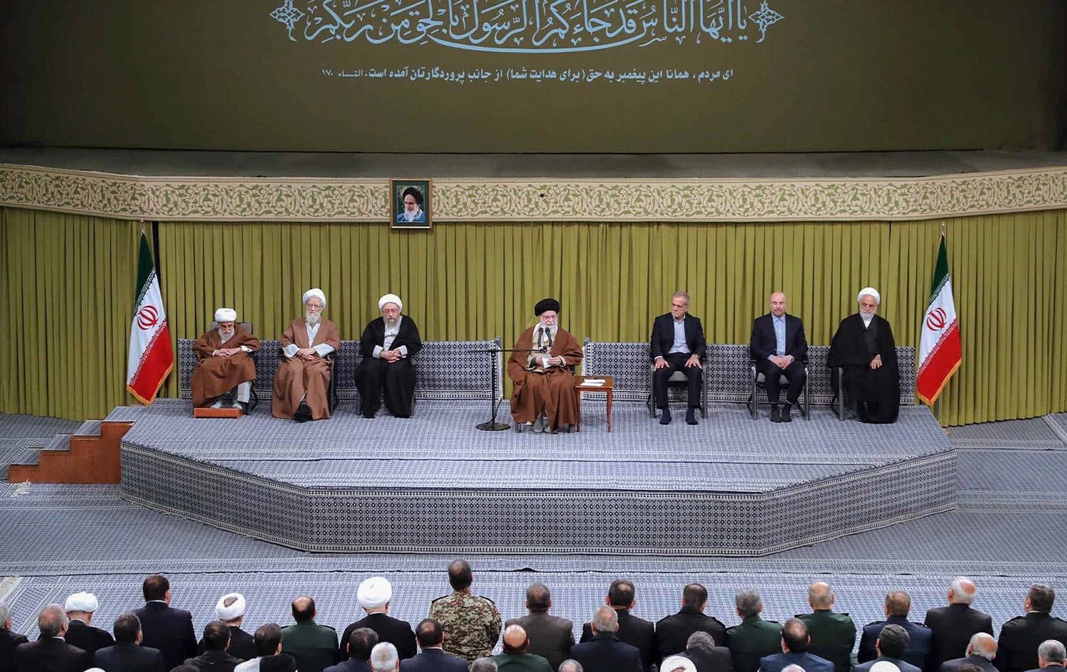 This handout picture provided by the the office of Iran's Supreme Leader Ayatollah Ali Khamenei shows him (C) addressing attendees while accompanied on stage by President Masoud Pezeshkian (3rd-R), Parliament Speaker Mohammad Bagher Qalibaf (2nd-R), and Judiciary Chief Mohsen Ejeie (R), during a meeting with officials in Tehran on January 28, 2025. Photo: Khamenei.ir/AFP