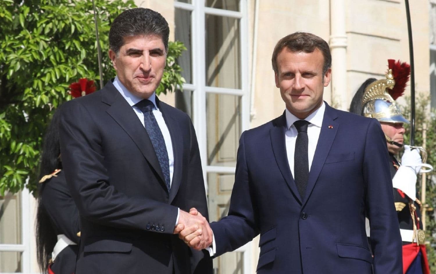President of the Kurdistan Region Nechirvan Barzani (left) shakes hands with French President Emmanuel Macron at Elysee Palace in Paris in July 2019. File photo: Ludovic Marin / AFP