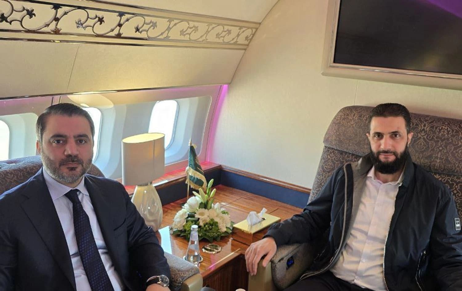 Syrian leader Ahmed al-Sharaa (right) and Foreign Minister Asaad al-Shaibani (left) on board a private jet en route to Riyadh on February 2, 2025. Photo: Sharaa's office