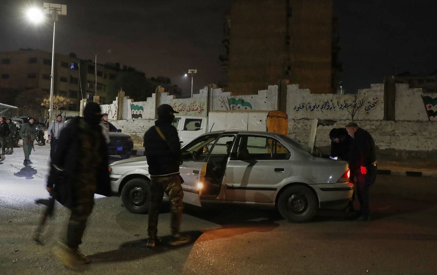 Syrian security forces inspect a car after their deployment to the outskirts of Damascus on March 6, 2025. Photo: AP