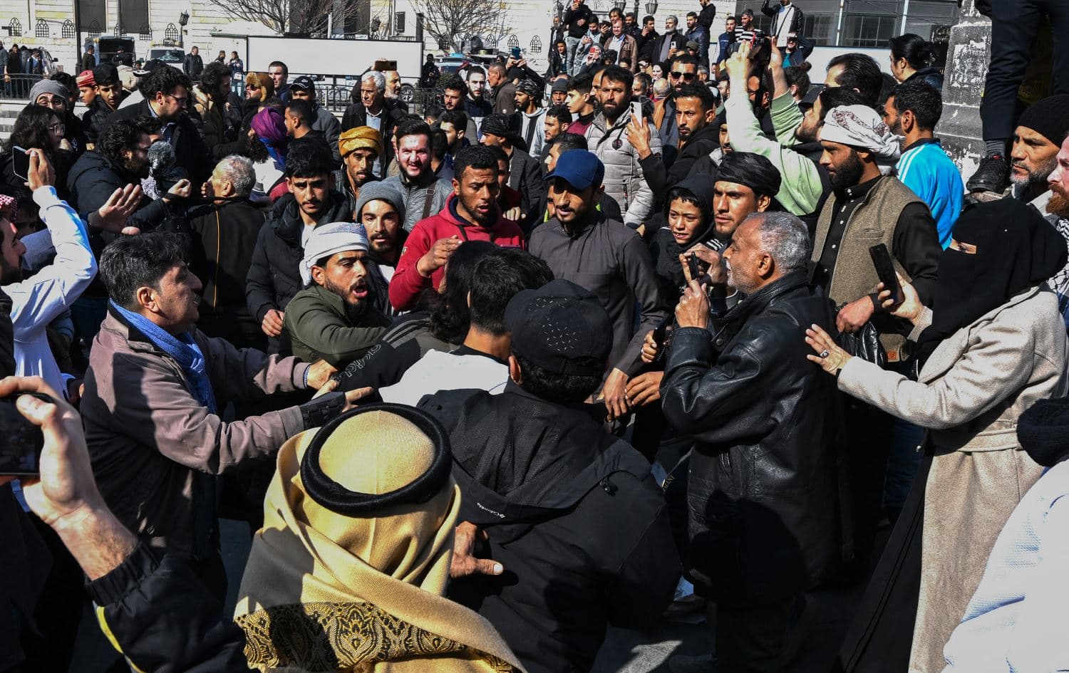 An argument breaks out between protesters and others from a counter-demonstration at al-Marjeh square in Damascus on March 9, 2025. Photo: AFP