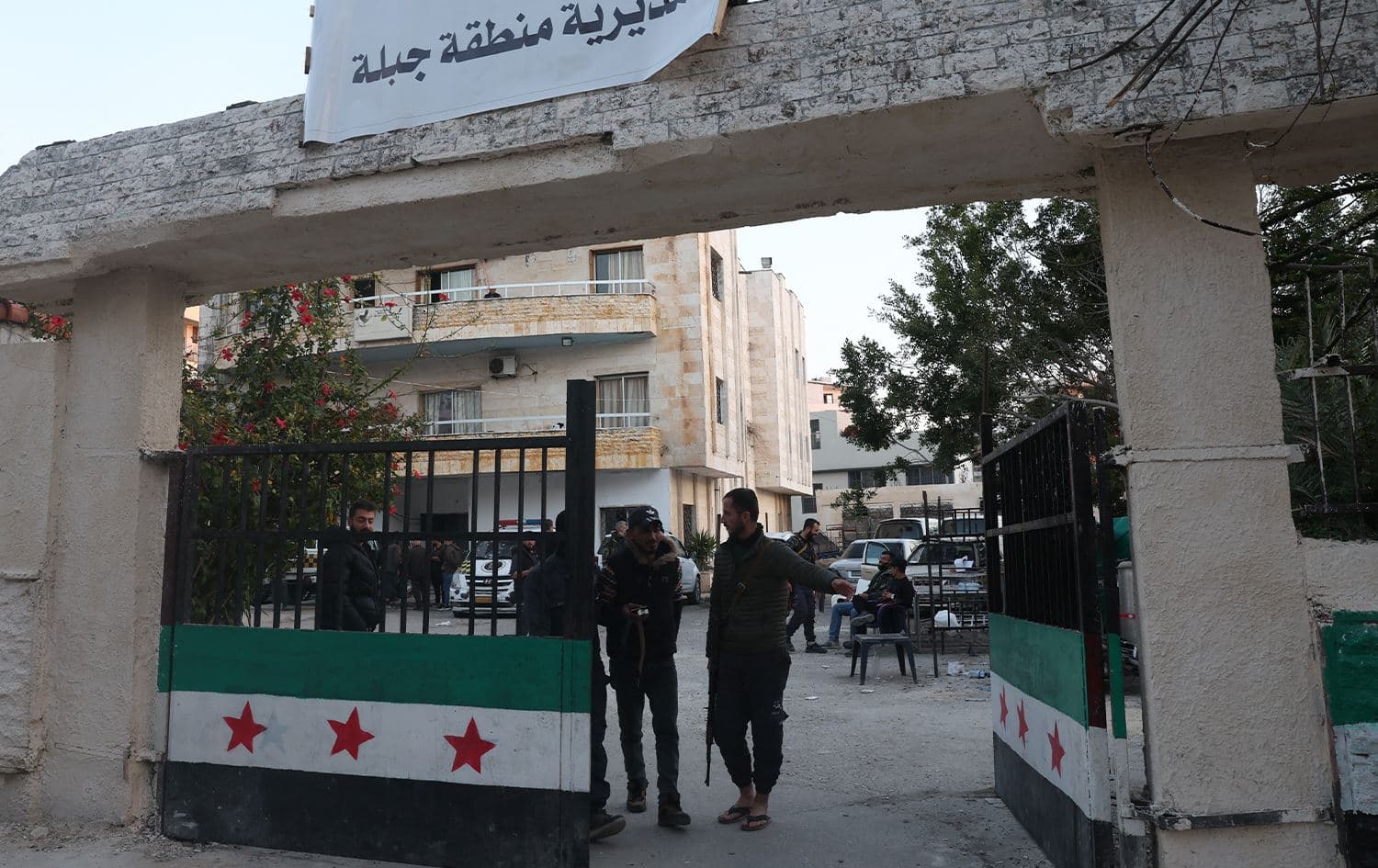 Security forces with Syria's new government gather in the municipality building in the town of Jableh in the coastal province of Latakia on March 10, 2025. Photo: AFP