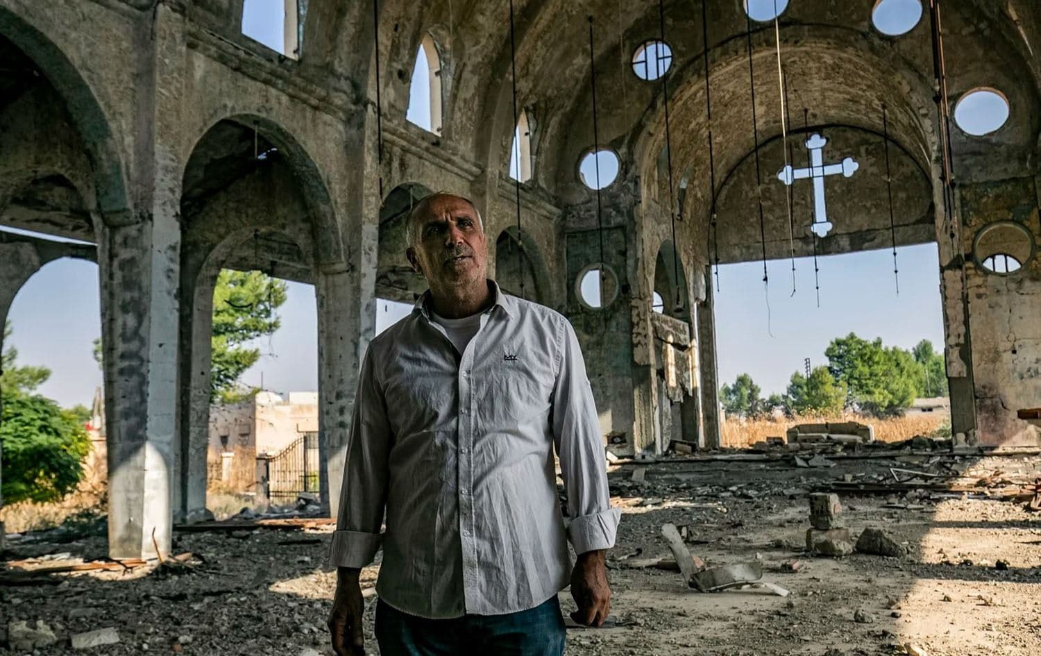 An Assyrian Christian from the Assyrian Church of the Virgin Mary, which was destroyed by the Islamic State group, in the village of Tal Nasri in northeastern Hasakah province, on November 15, 2019. Photo: AFP