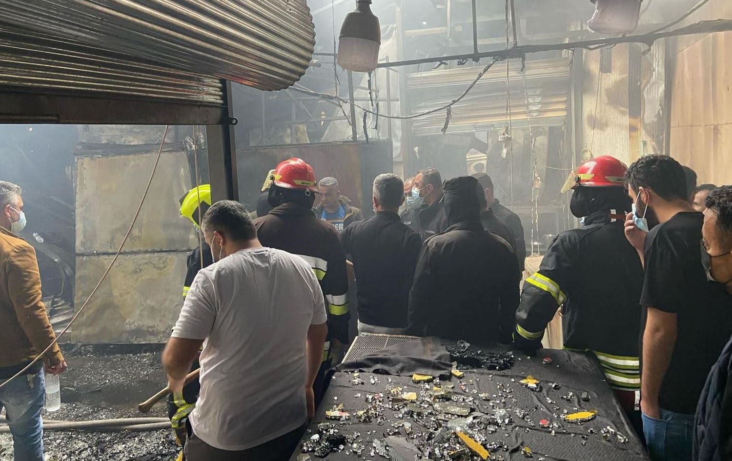 Fire fighters at the scene of a blaze in a Sulaimani bazaar on April 5, 2025. Photo: Rudaw