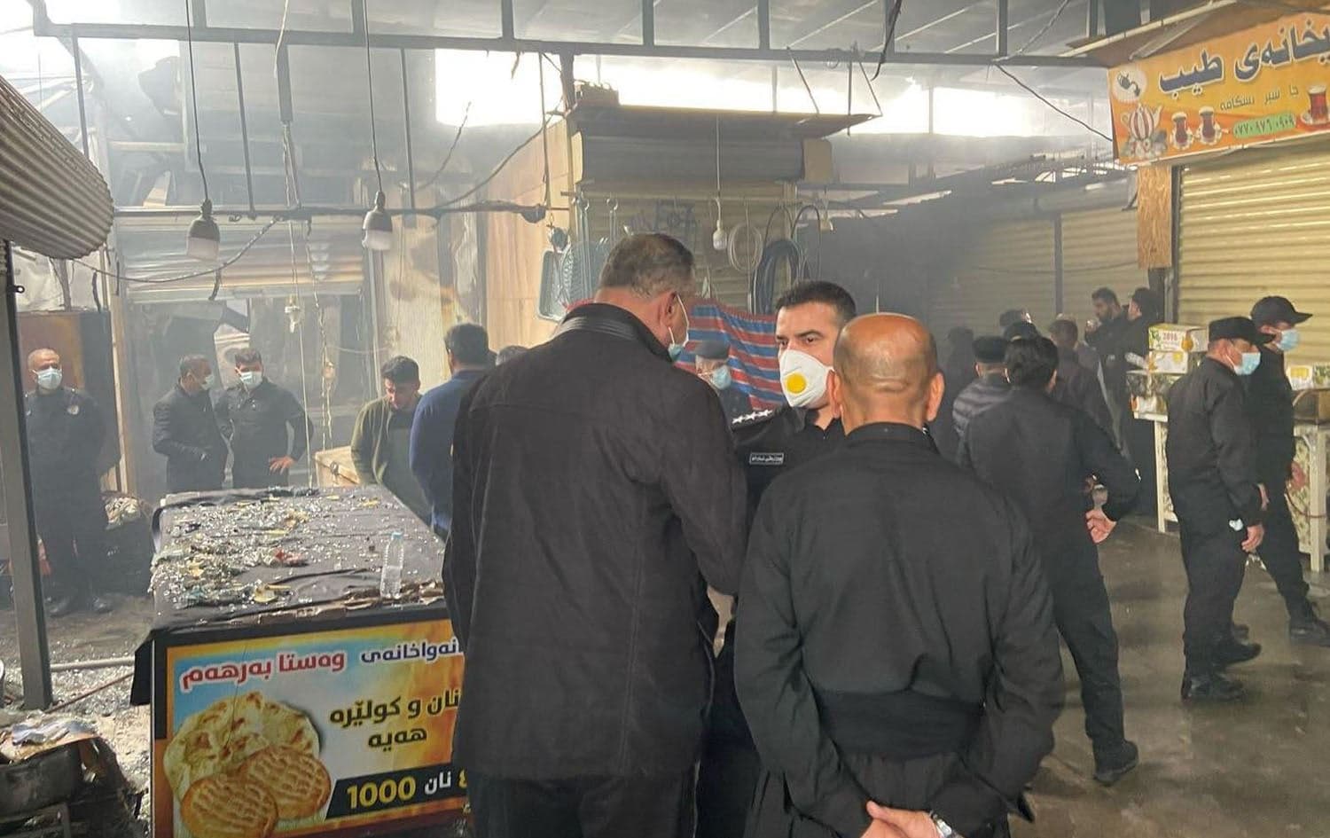 Police inspect scene of fire at Sulaimani’s Dara Sutawaka on April 5, 2025. Photo: Rudaw