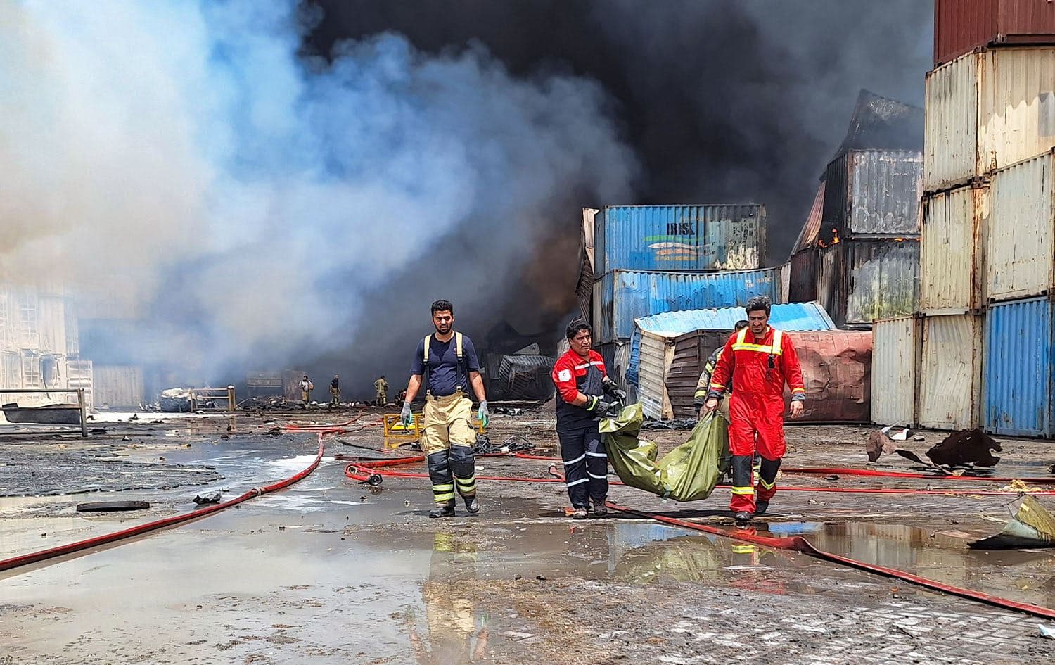 Firefighters carry a victim at the scene of an explosion that took place a day earlier at the Shahid Rajaee port dock, southwest of Bandar Abbas in the Iranian province of Hormozgan, on April 27, 2025. Photo: AFP