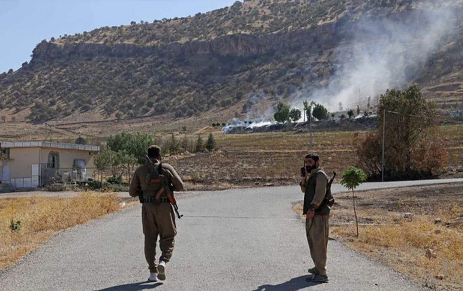 Kurdish fighters inspect damage after an Iranian cross-border attack in Zargwez, Sulaimani on September 28, 2022. Photo: AFP