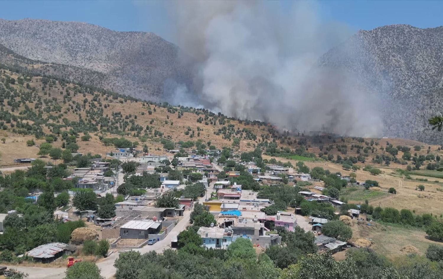 A fire in the vicinity of a Duhok village caused by Turkey-PKK fighting on July 4, 2024. Photo: Rudaw