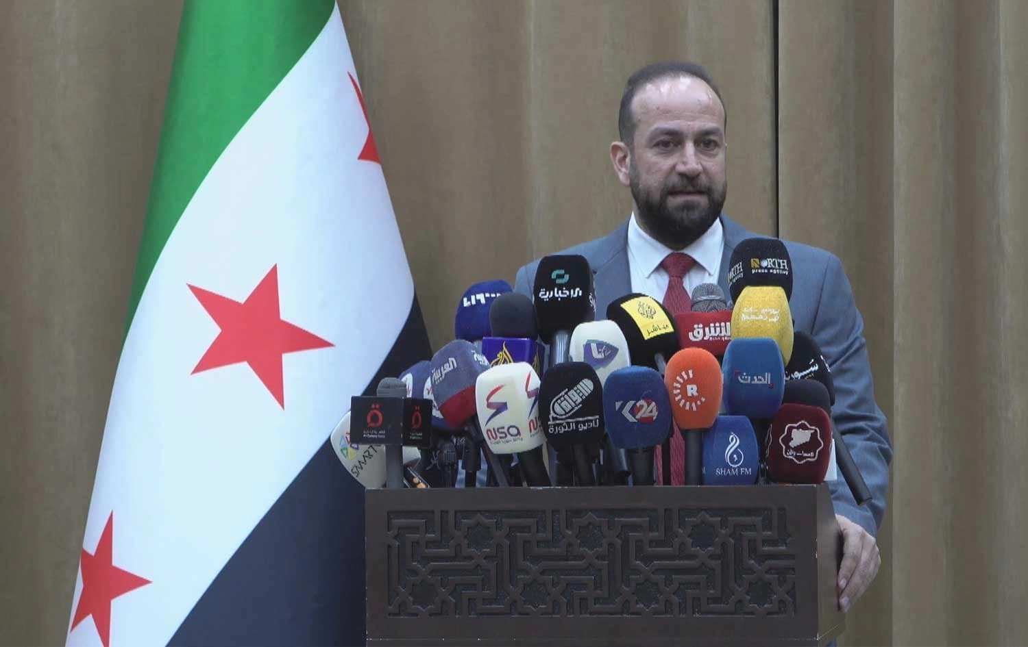 Syria's Information Minister Hamza al-Mustafa speaking in a press conference in Damascus on May 30, 2025. Photo: Rudaw