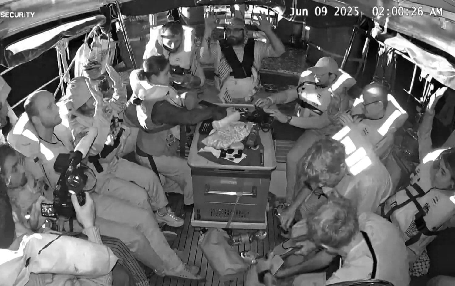 An image grab from footage released by Freedom Flotilla Coalition on June 9, 2025, shows activists on board the Gaza-bound aid boat Madleen being intercepted by the Israeli forces. Photo: AFP/Freedom Flotilla Coalition