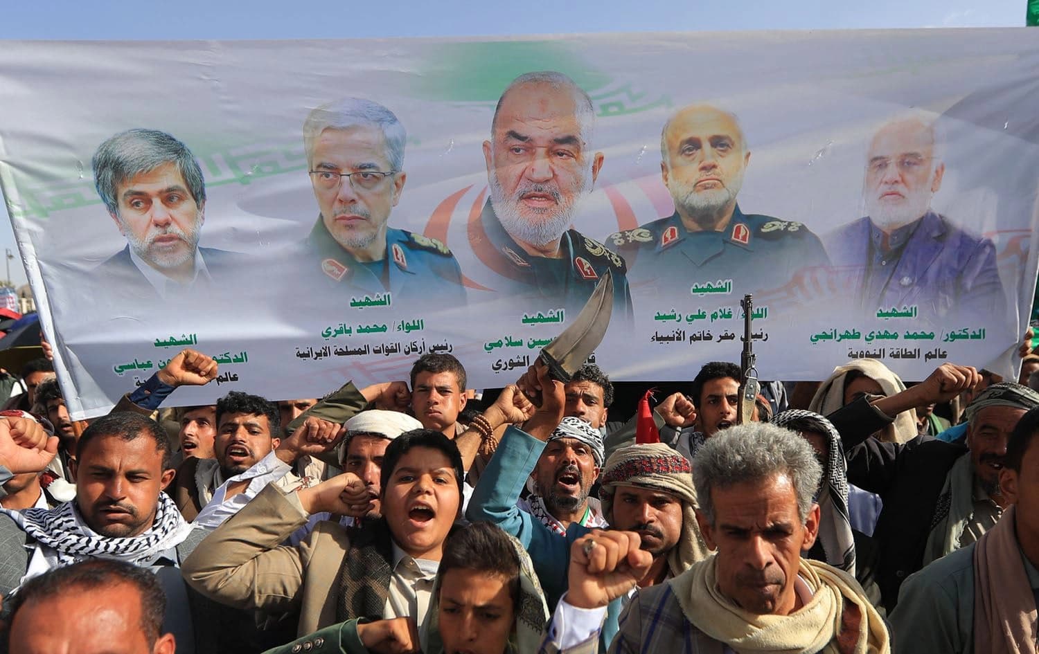 Yemenis carry portraits of slain Iranian generals and scientists during a rally in solidarity with the Gaza Strip and to condemn the Israeli strikes on Iran, in Sanaa on June 13, 2025. Photo: Mohammed Huwais/AFP