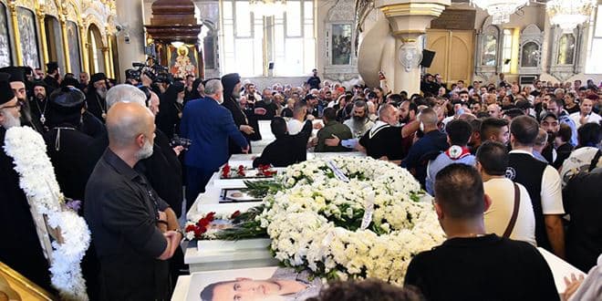 Mourners lay victims of Mar Elias church attack to rest at Holy Cross church in Damascus on June 24, 2025. Photo: SANA