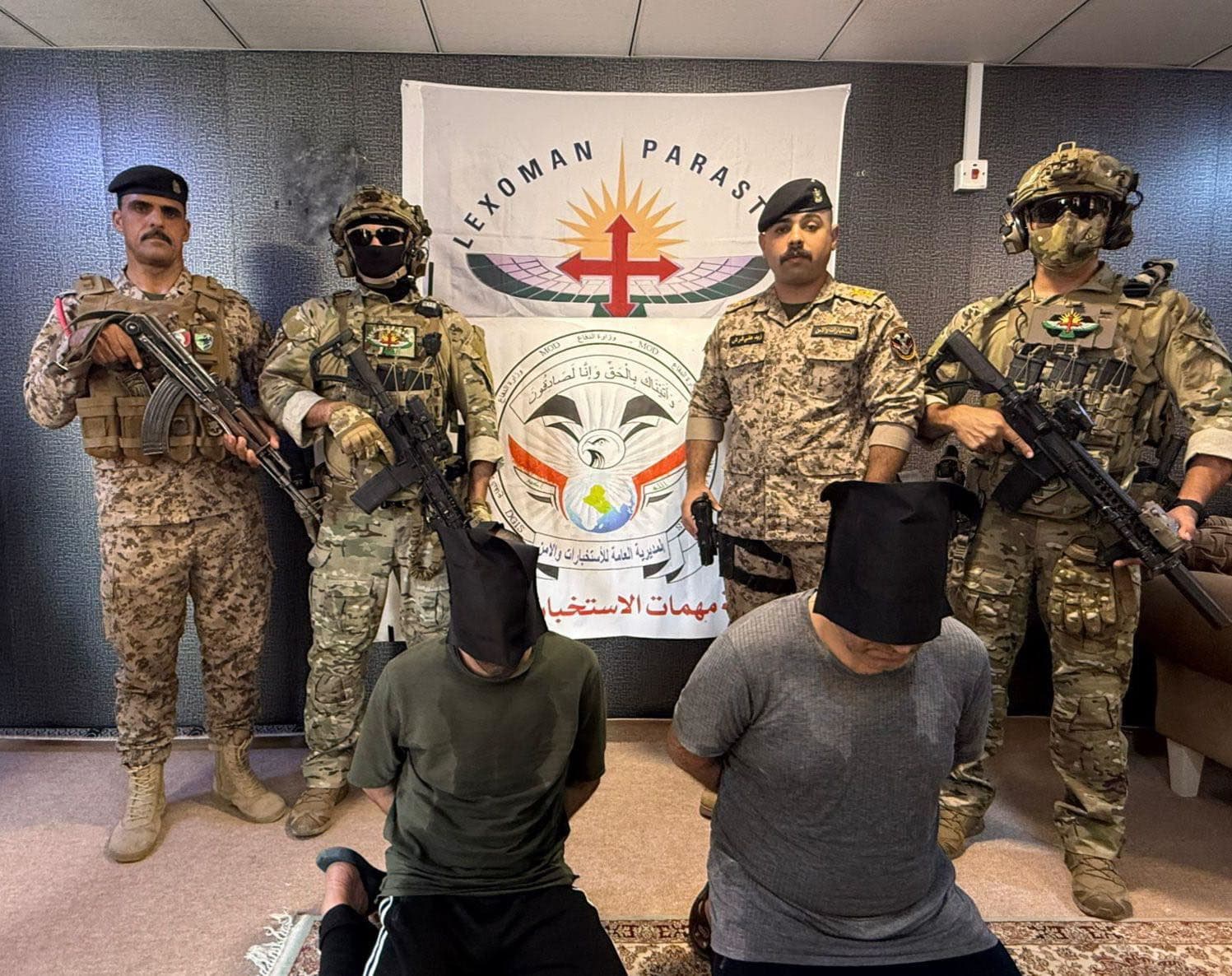 Kurdish and Iraqi security forces and two "terrorists" they arrested in Sulaimani province. Photo: CTG.