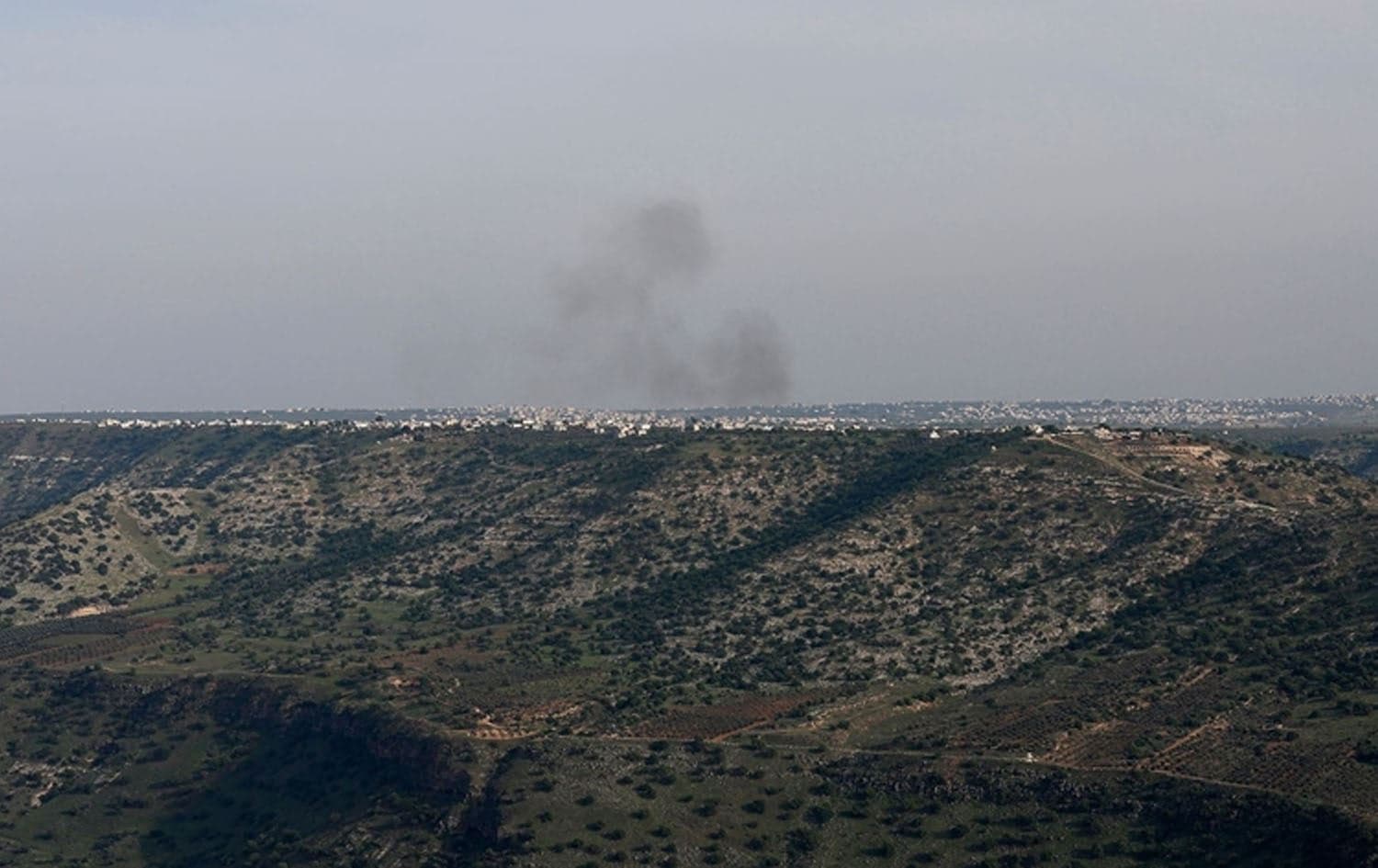 This picture taken from Israel-annexed Golan Heights along the border with southern Syria shows smoke billowing above the Syrian territory during Israeli bombardment, on March 25, 2025. Photo: Jalaa Marey/AFP