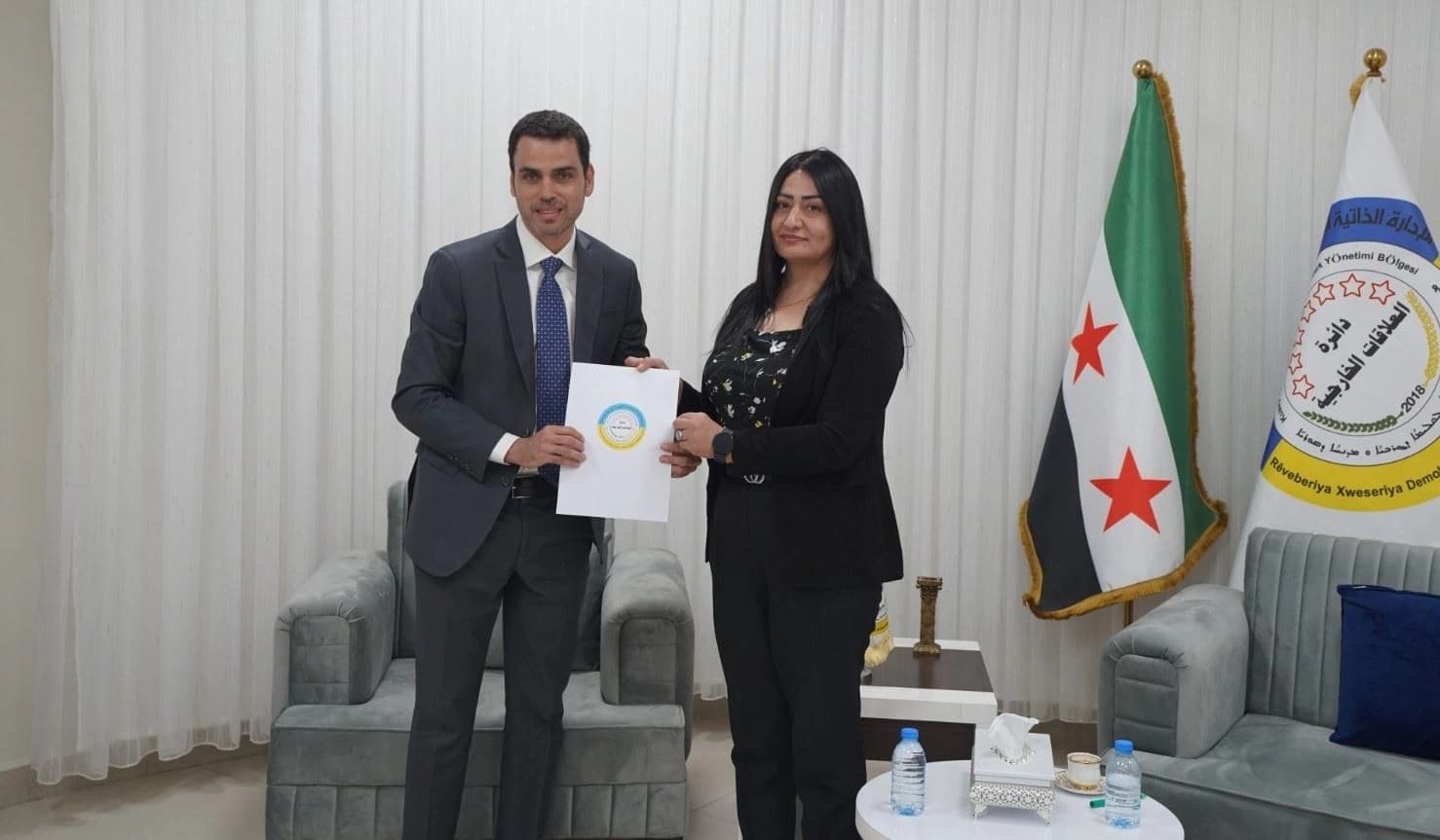 Joao Zanini, chargé d’affaires of the Brazilian embassy in Damascus (left) pictured with Kulistan Ali, deputy co-chair of DAANES foreign relations depament (right) in Rojava on August 24, 2025. Photo: Aanes.official/Facebook