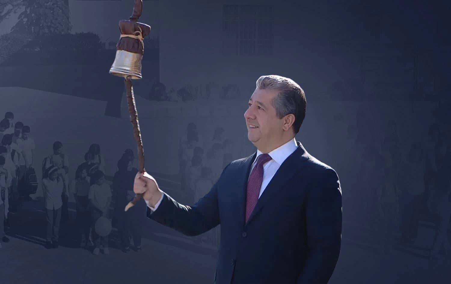 Kurdistan Region PM Masrour Barzani rings the ceremonial bell in a school in Zakho, Duhok province, marking the start of the new school year. Graphic: Rudaw English