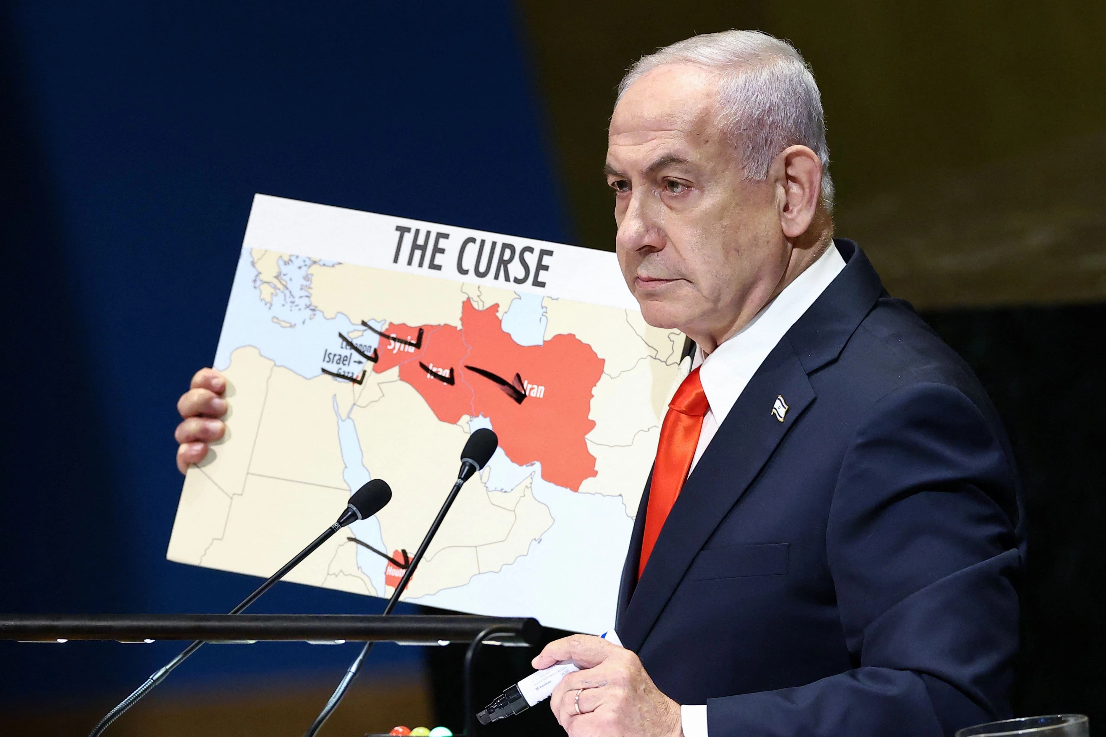 Israeli Prime Minister Benjamin Netanyahu, addressing the UN General Assembly on September 26, 2025, holds up a map titled “The Curse” that highlights Syria, Iraq and Iran.